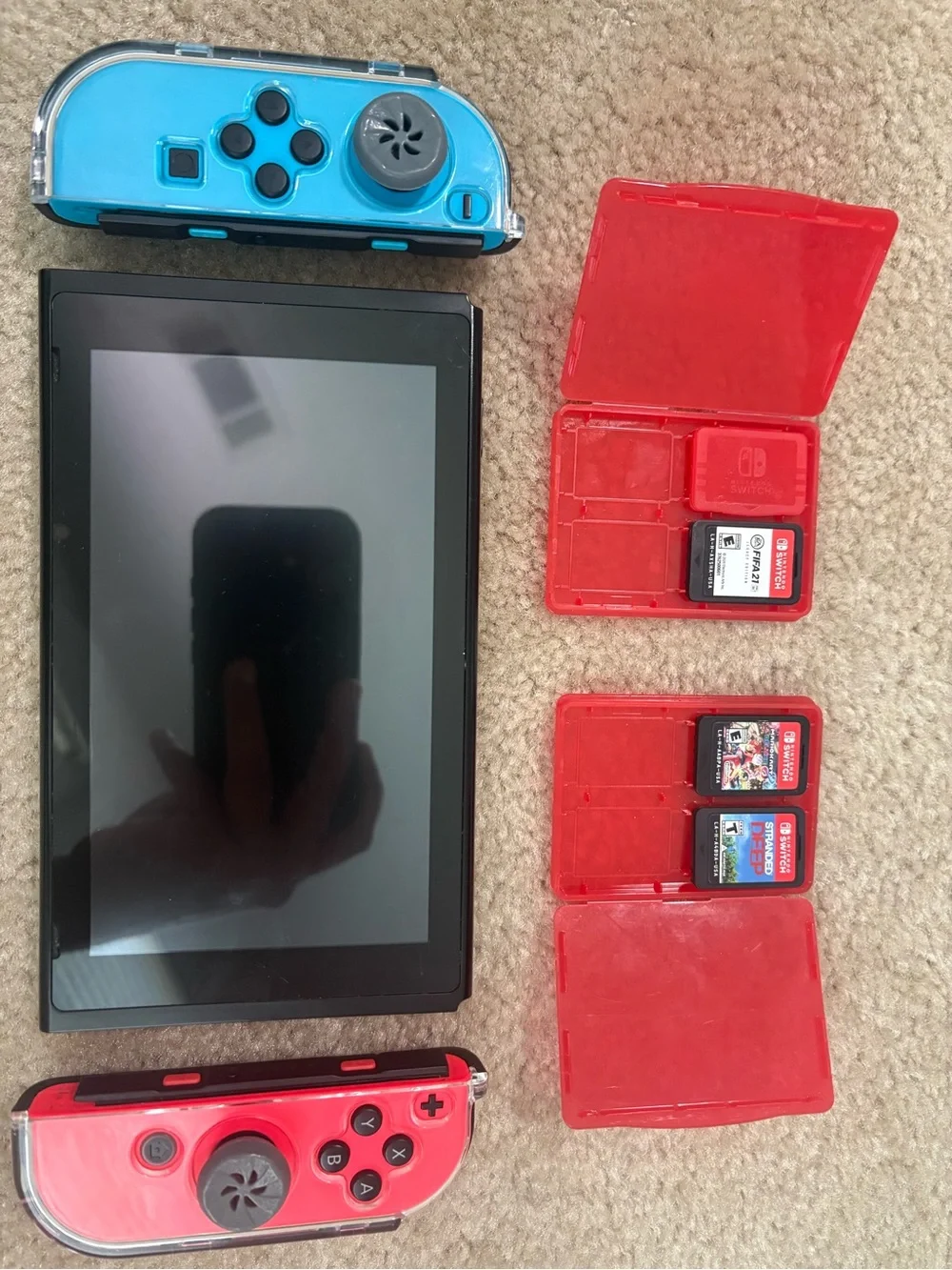 Nintendo Switch with Blue and Red Joy‑Con in Travel Case